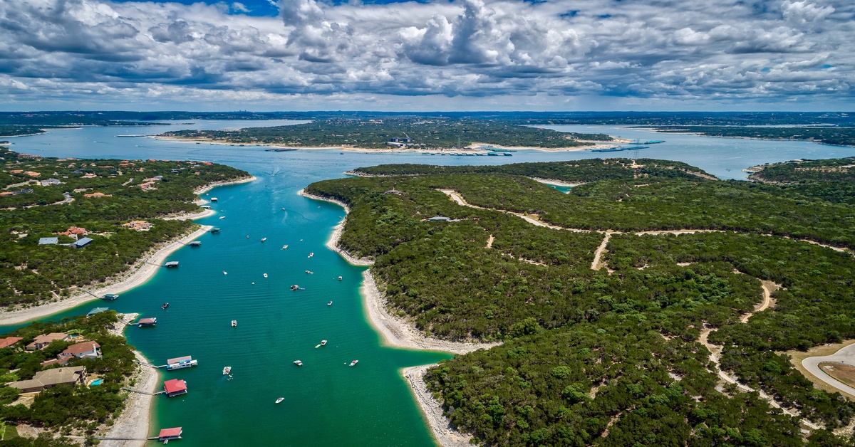 An aerial view above Lake Travis in Austin, Texas. Viewers can see the connected lakes, houses, and boats on Lake Travis. An aerial view above Lake Travis in Austin, Texas. Viewers can see the connected lakes, houses, and boats on Lake Travis.